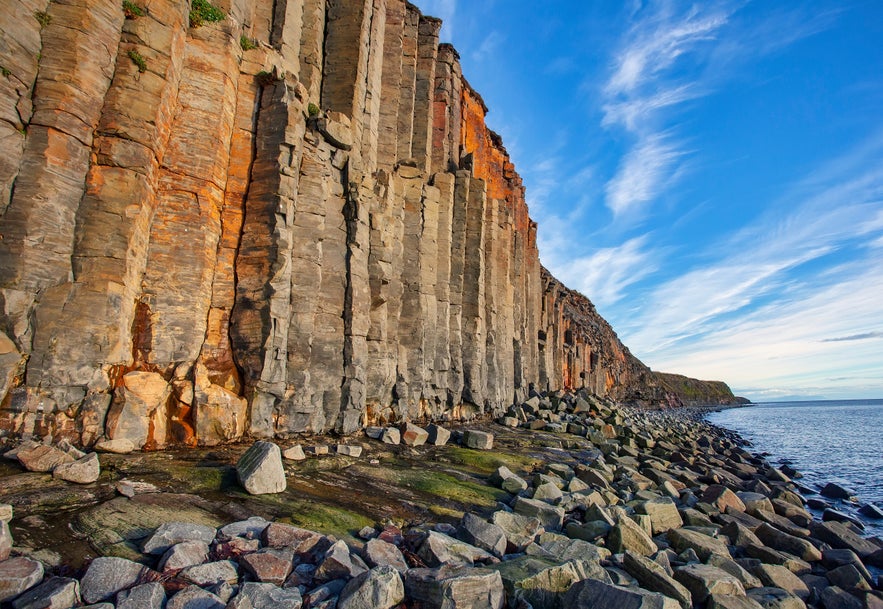Tall basalt columns lining the coast at Gerduberg Cliffs in West Iceland.