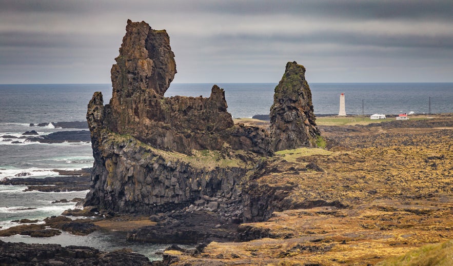 Basalt rock spires of Londrangar rising above the Atlantic coastline on the Snaefellsnes Peninsula, Iceland.