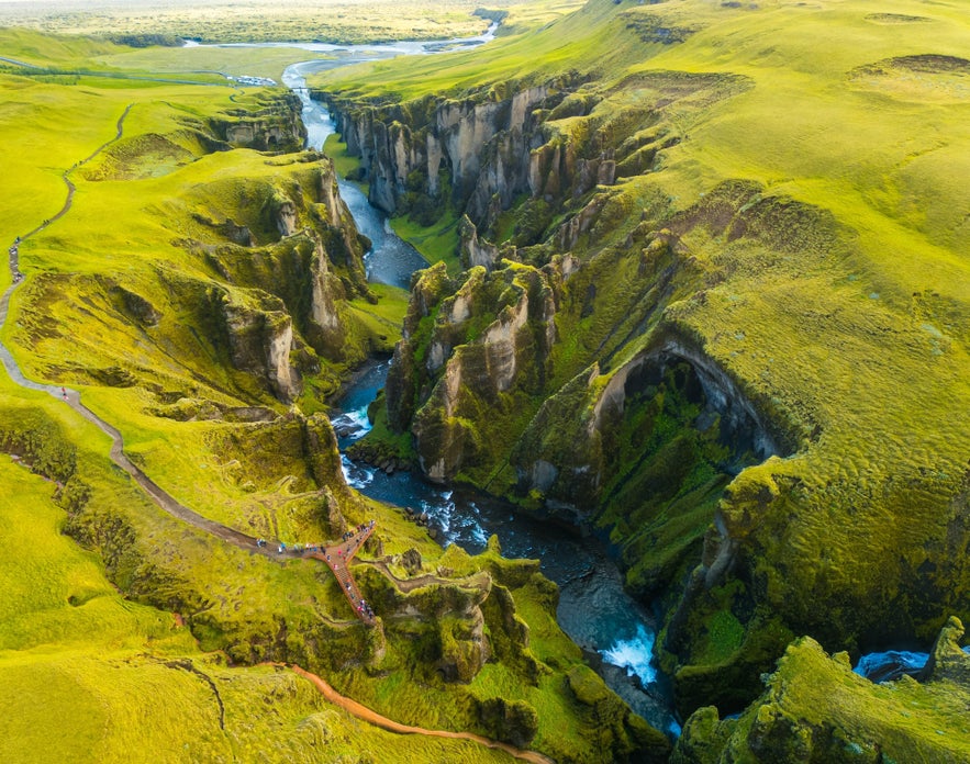 Aerial view of Fjadargljufur canyon with walking trail and river in South Iceland.