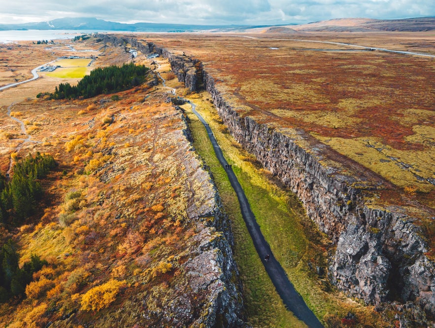Aerial view of Thingvellir National Park with autumn colors and tectonic rift valley in South Iceland.