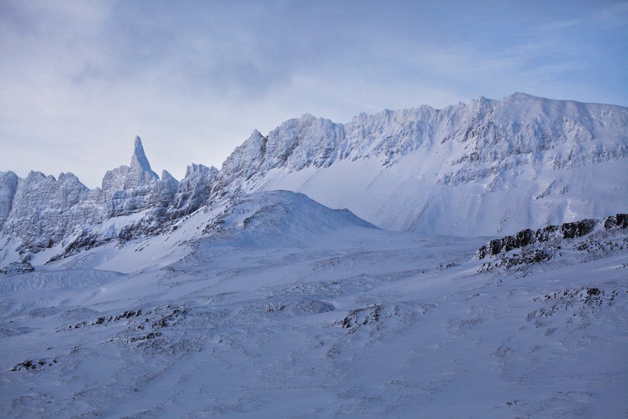 Hraundrangi Mountain Peak covered in snow