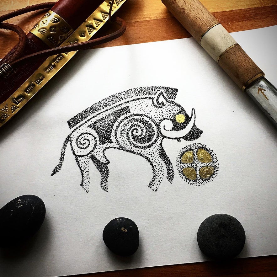 Hand-poke tattoo design of a wild boar drawn on paper.