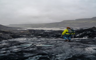 A traveler on a glacier hike on Solheimajokull in South Iceland.
