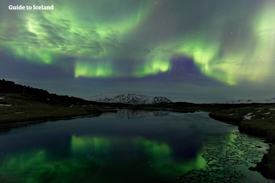 The beautiful northern lights at Silfra fissure in Iceland.