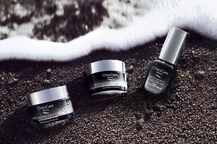 ChitoCare Beauty anti-aging day, night, and eye creams are displayed on black sand with a gentle ocean wave. ChitoCare Beauty anti-aging day, night, and eye creams are displayed on black sand with a gentle ocean wave.