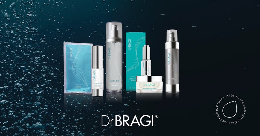 Dr. BRAGI Marine Skincare products in Iceland, including various bottles, creams, and sachets, on a dark, wet background. Dr. BRAGI Marine Skincare products in Iceland, including various bottles, creams, and sachets, on a dark, wet background.