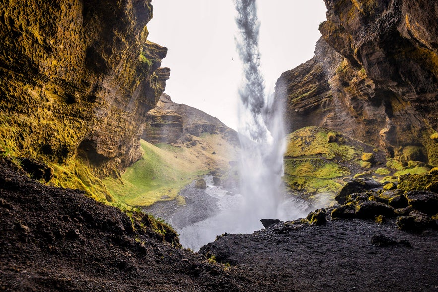 Kvernufoss Waterfall is one of the waterfalls you can walk behind in Iceland.