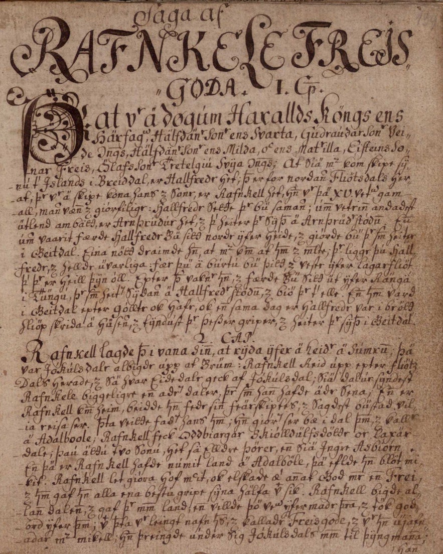 Manuscript page from Hrafnkels Saga, featuring decorative calligraphy at the top and densely written Old Norse text below, all on aged parchment.