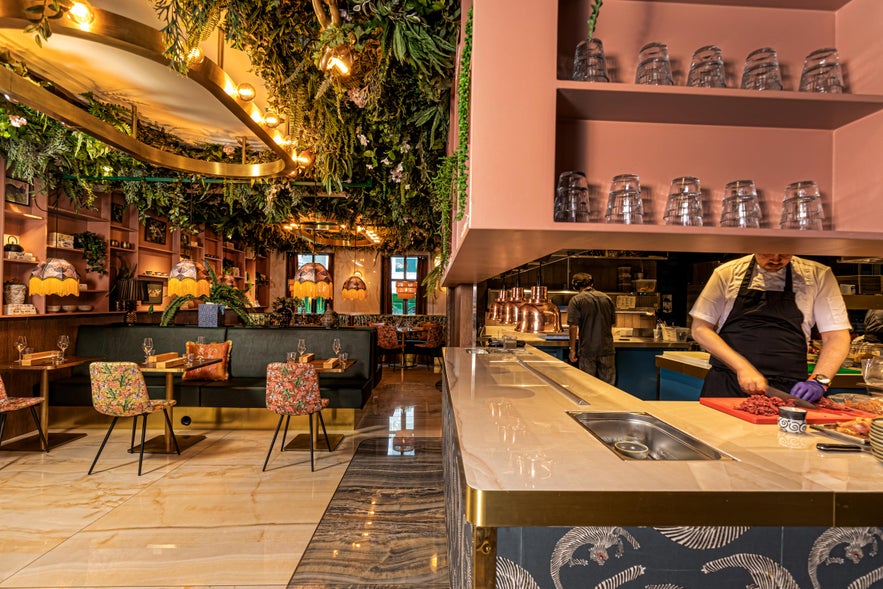 Stylish restaurant interior in Reykjavik, showing dining etiquette and local food culture for how to travel in Iceland.