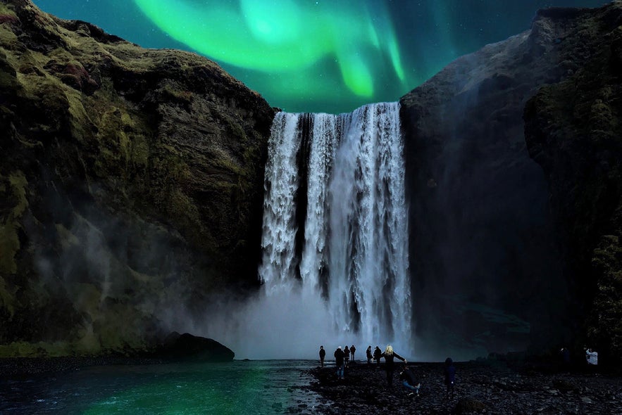 Skogafoss waterfall in Iceland under the northern lights