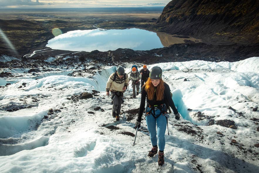Hikers with crampons and ice axes on a Vatnajokull outlet glacier Hikers with crampons and ice axes on a Vatnajokull outlet glacier