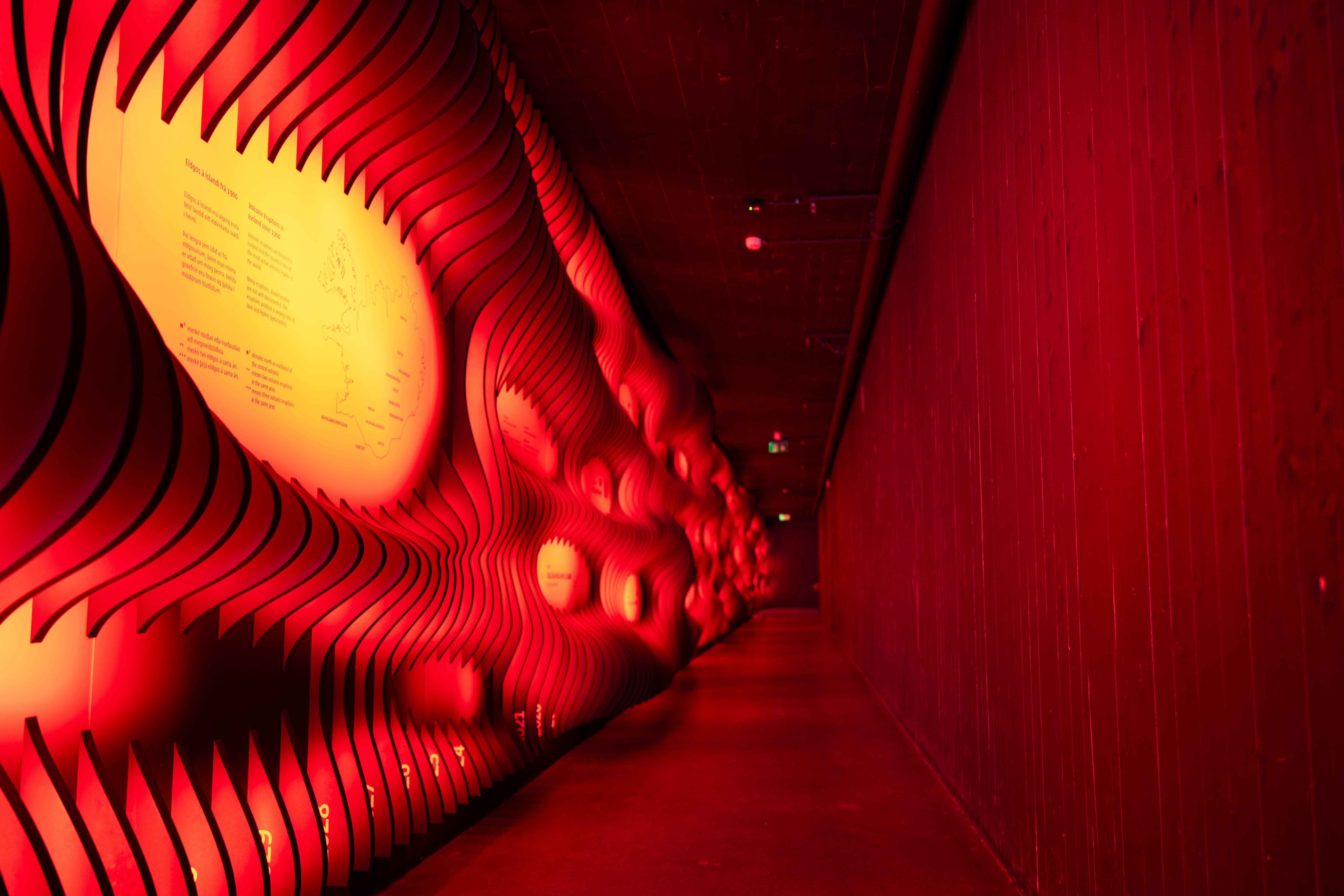 Red-lit interior display at South Iceland's Lava Center showcasing Iceland’s volcanic activity.