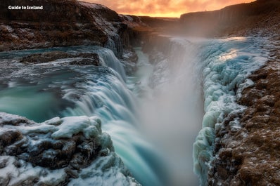 The gullfoss waterfall, one of three Golden Circle attractions, is covered in a blanket of snow and ice in winter.