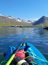 Stand-up paddle-boarding on the calm waters of the Siglufjordur fjord in North Iceland is a magical experience.