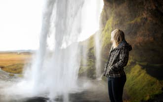 Get your photos taken by a professional photographer as you explore the majestic Seljalandsfoss waterfall.