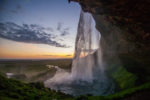 The beautiful Seljalandsfoss waterfall lets you walk behind its water curtain.