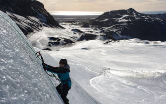 During a glacier hiking tour on the Solheimajokull glacier, you can try your hand at ice climbing.
