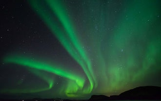 A curtain of northern lights in Iceland looks magical.