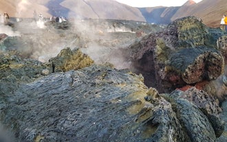 Steam rises from the rocks in a geothermal area on the Reykjanes Peninsula.