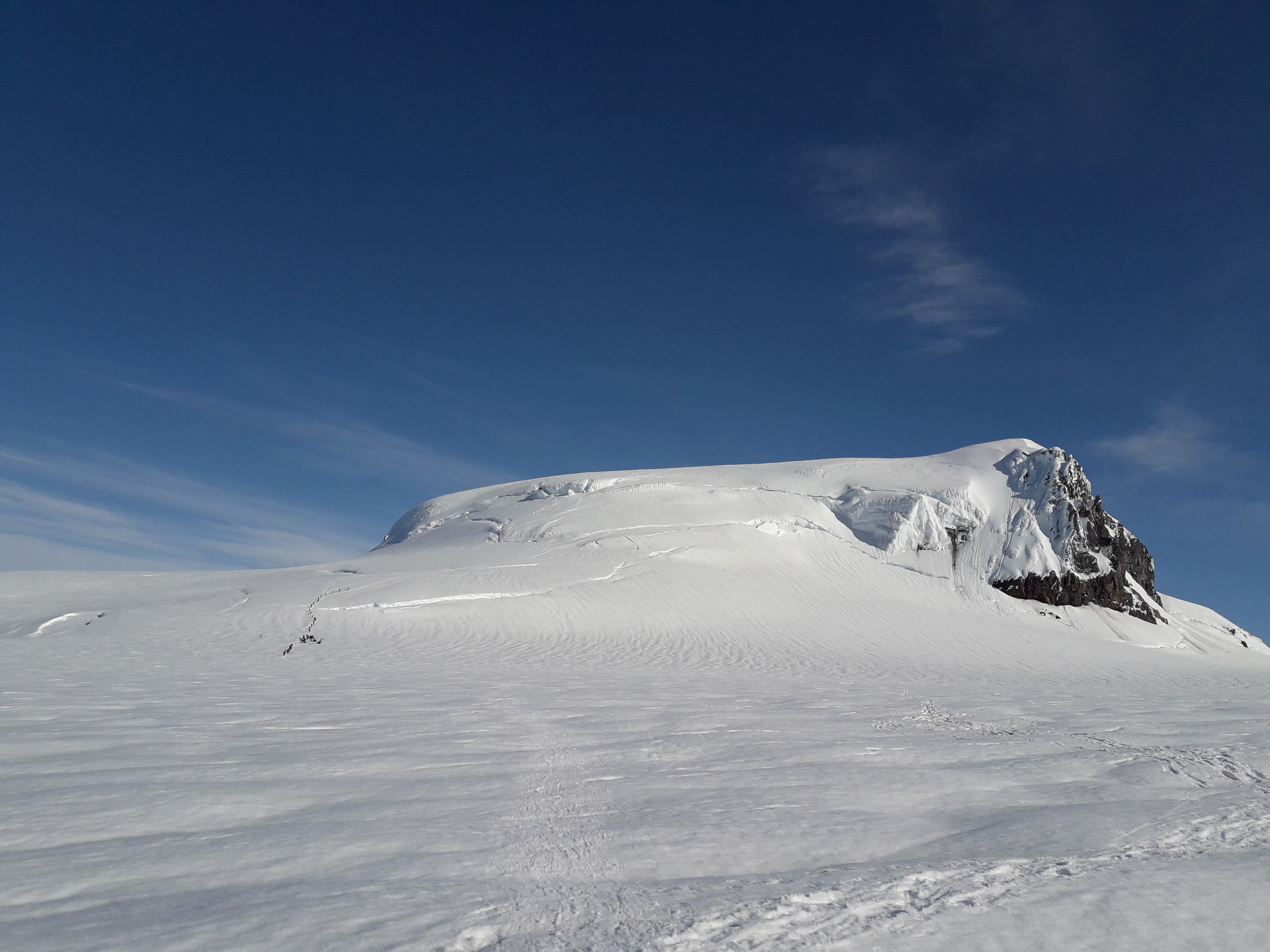 Glacier and snow cover the beautiful Hvannadalshnjukur peak in Iceland.
