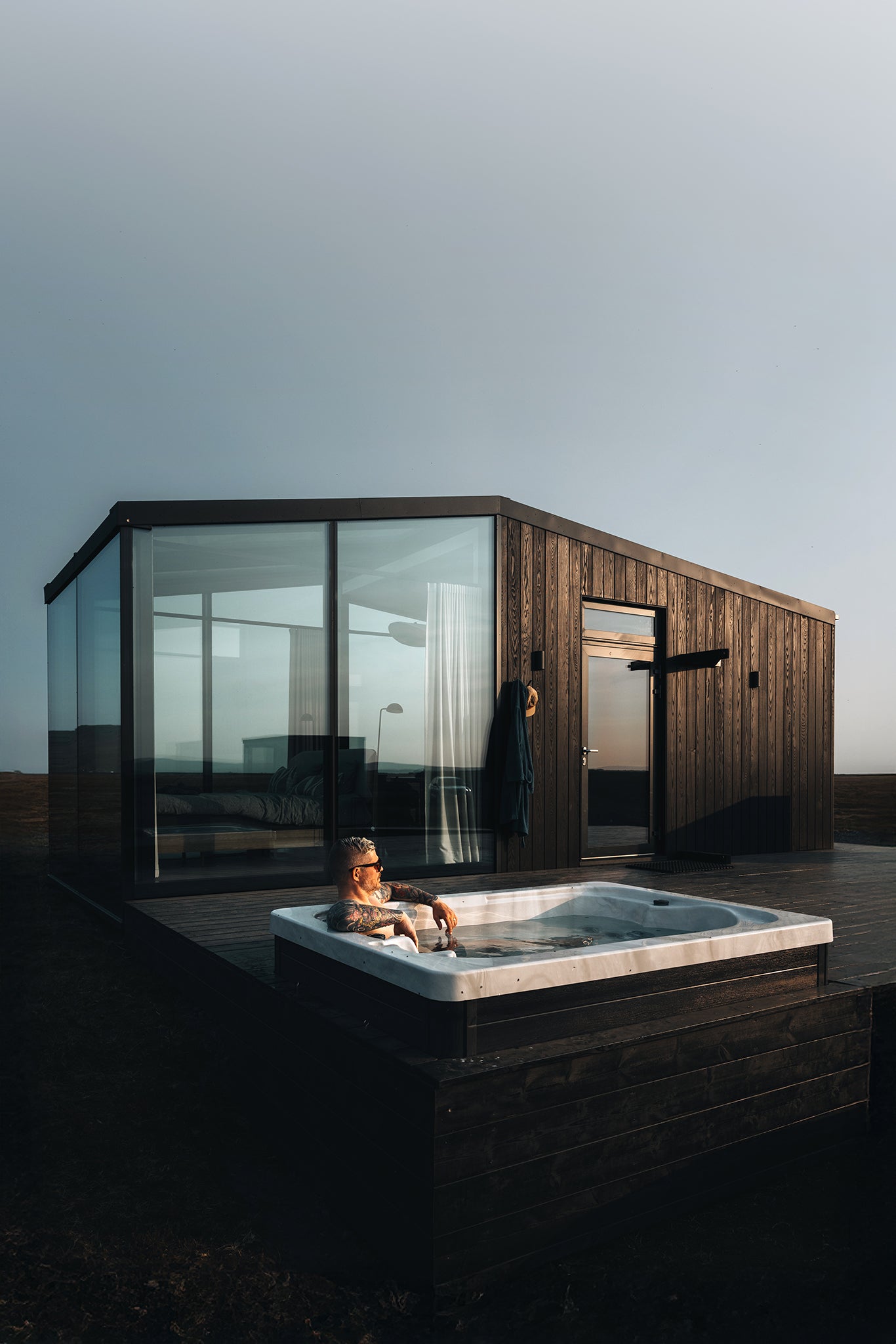 Man enjoys a private retreat at Harmony Seljalandsfoss accommodation in South Iceland.