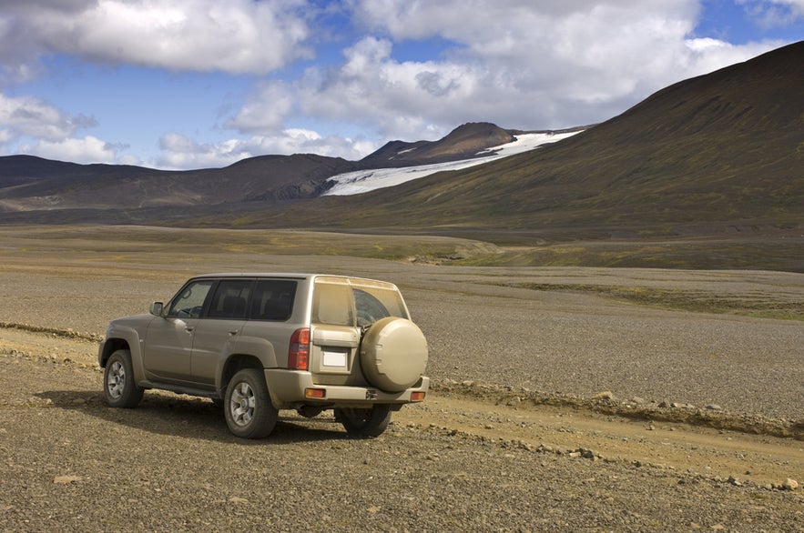 4x4 vehicle on a rugged Highland road near Thorsmork, Iceland, with glacier views and remote mountain scenery.