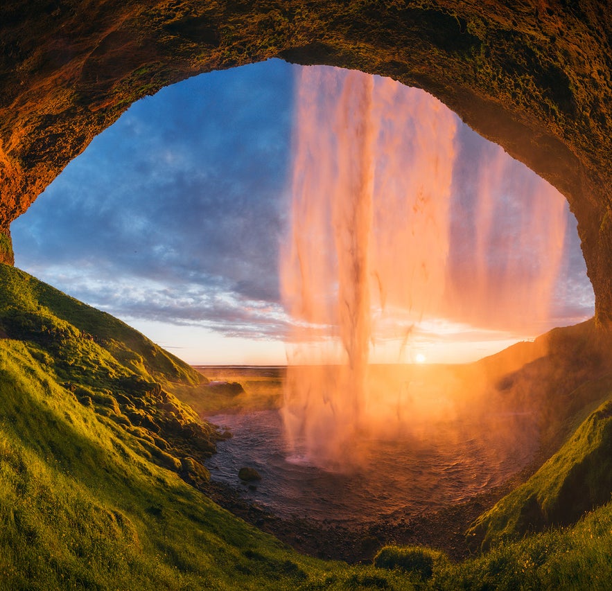 Seljalandsfoss waterfall from the cave behind it, located in Iceland