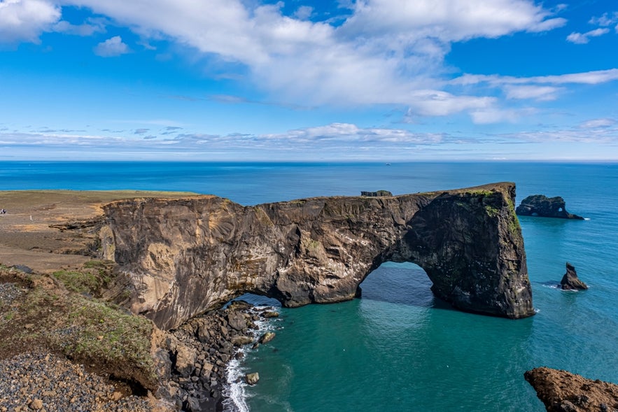 View of Dyrholaey Rock Arch on Iceland’s South Coast, a scenic viewpoint near Yoda Cave and Reynisfjara Beach.