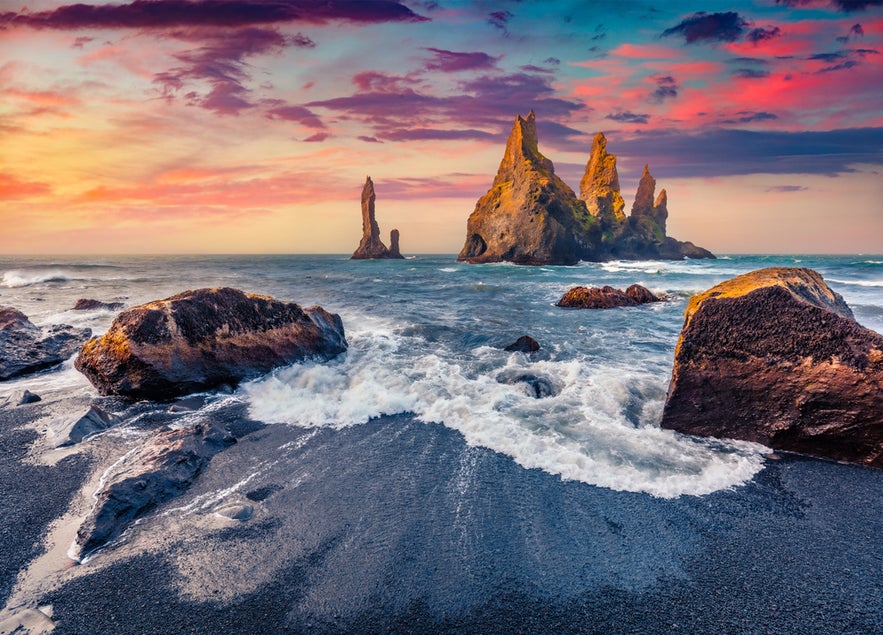 View of Reynisdrangar Sea Stacks at Reynisfjara Beach near Vik, a dramatic South Iceland coast near Yoda Cave.