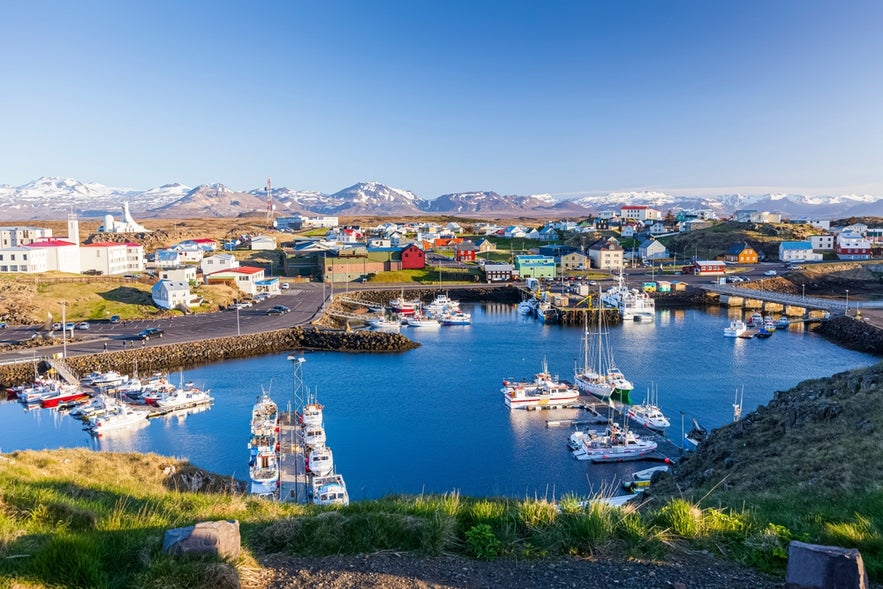 Colorful houses and boats in the scenic harbor of Stykkisholmur.