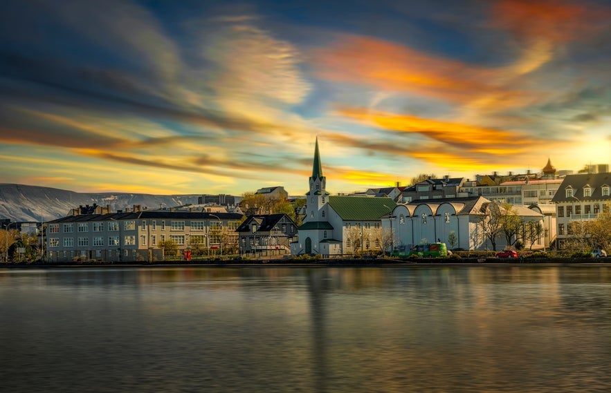 Colorful sunset over Reykjavík city center, a popular destination for shopping and culture in Iceland.