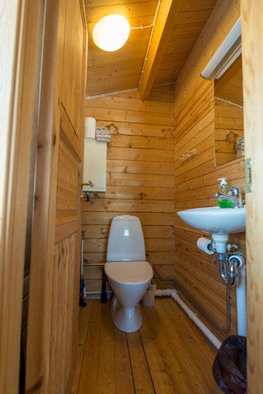 One of the bathrooms at Gladheimar cottages with a sink and toilet.