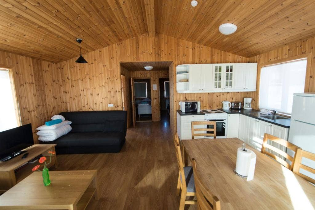 The living area in one of the Gladheimar cottages with a view through to the bedroom at the back.