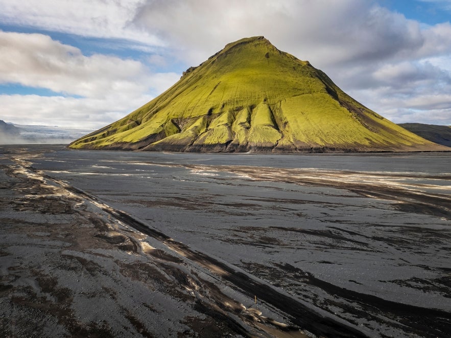 Maelifell stands in a barren volcanic plain, showing the harsh landscape shaped by loss of forests in Iceland.