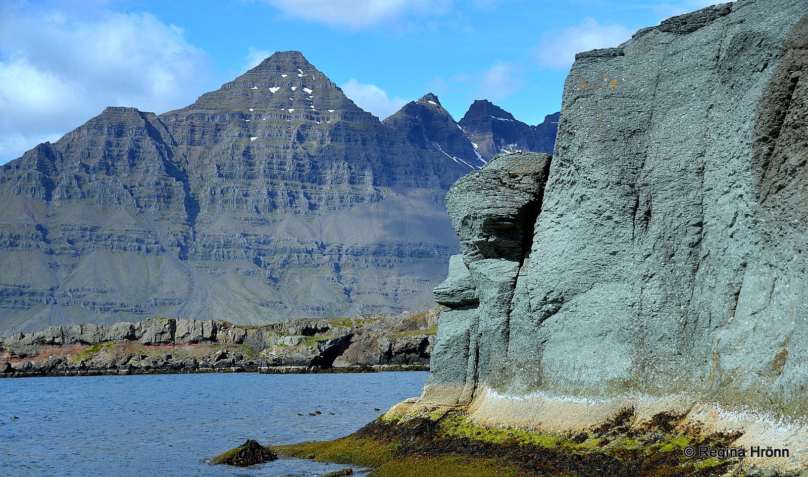 The amazing turquoise Blábjörg Cliffs in Berufjörður in East Iceland