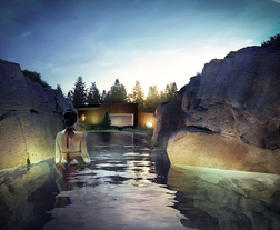 Woman relaxing in the secluded grotto of Laugaras Lagoon in Iceland.