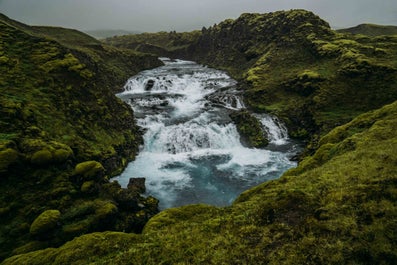 Marvel at rushing waterfalls as you hike through the Icelandic Highlands.