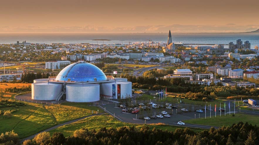 Perlan and the Reykjavik skyline on a sunny July day, the warmest month in Iceland at an average 53°F (11.7°C).