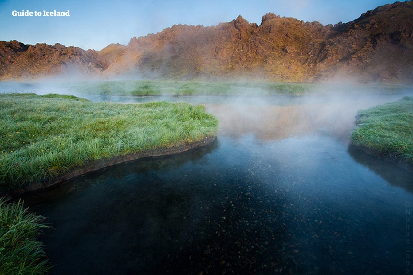 Steam rises from water in a geothermal area of the Icelandic Highlands.
