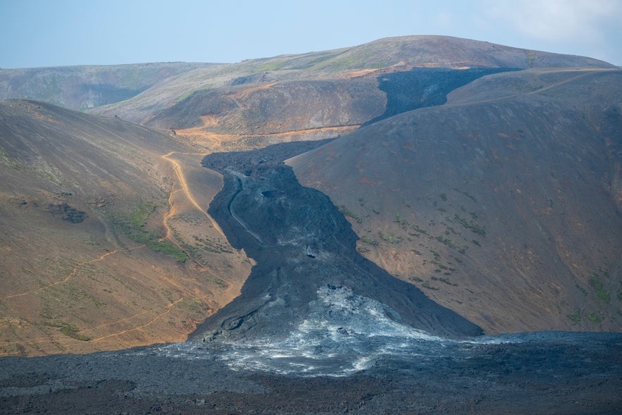 Lava rock covers a valley at Fagradalsfjall Volcano, part of the first stage of Iceland’s scenic Volcanic Way route.