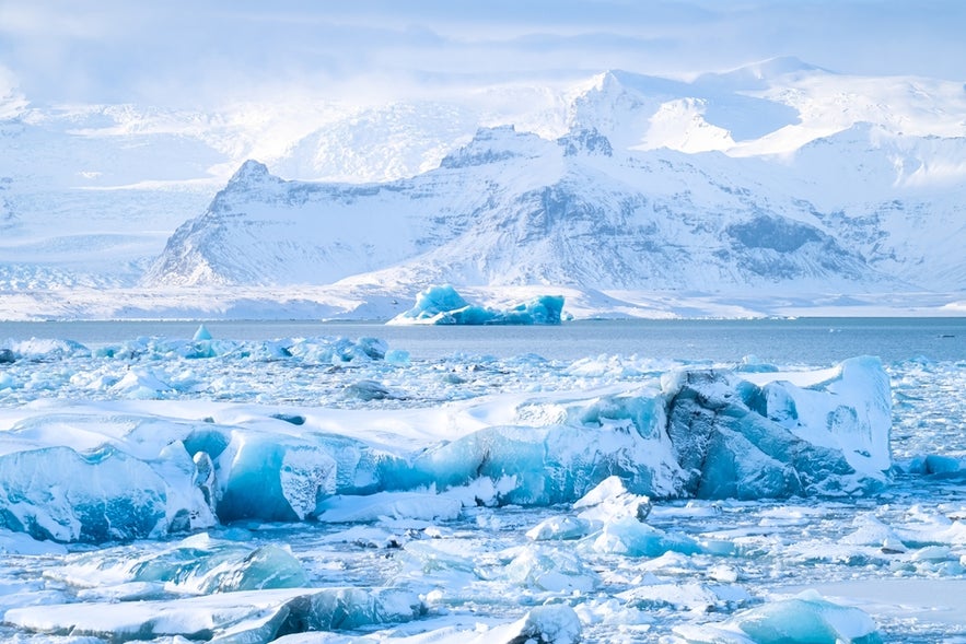 Frozen lake and blue icebergs at Vatnajokull National Park, where Iceland’s Volcanic Way comes to its stunning end.