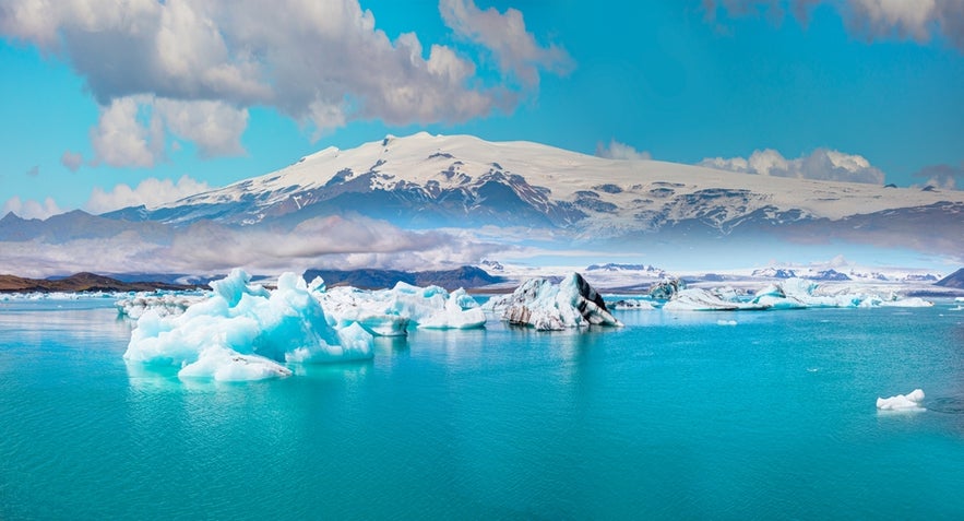 Jokulsarlon Glacier Lagoon with floating icebergs and Katla volcano, a key stage of the Volcanic Way in Iceland.