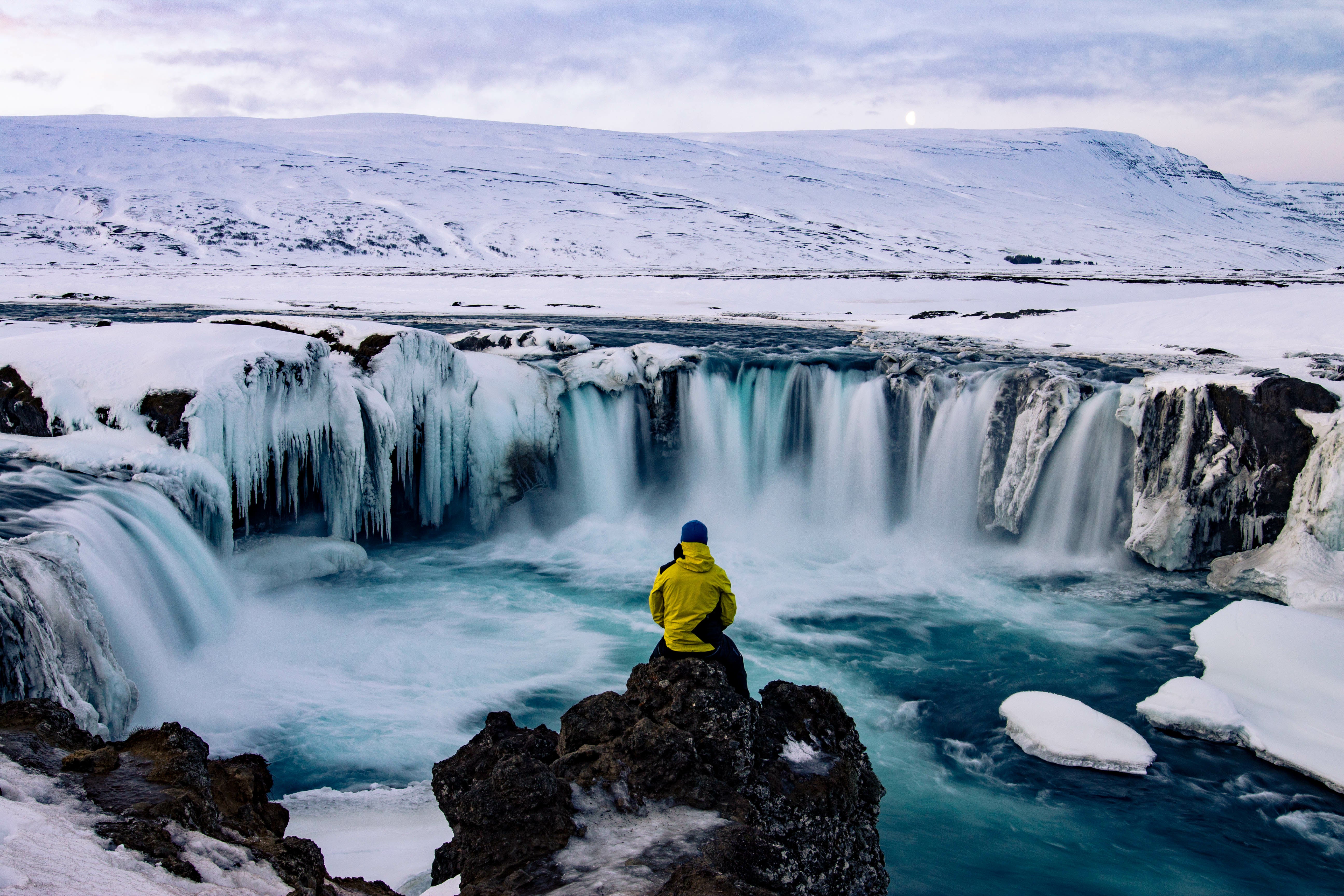 Captivating Frozen Beauty: Godafoss Waterfall in its winter splendor.