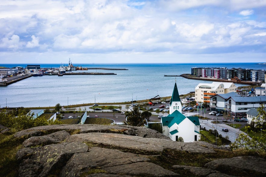 View of Hafnarfjordur Harbor and church, a scenic port near Reykjavik visited on Iceland by cruise ship trips.