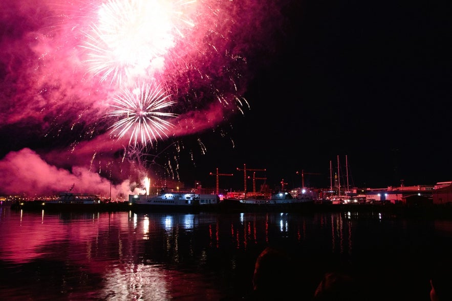 Fireworks over Reykjavik Harbor during Culture Night, a highlight for travelers driving in Iceland in August.