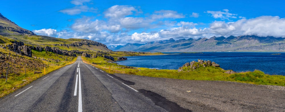 Driving the full-country Ring Road through varied Icelandic landscape in summer.