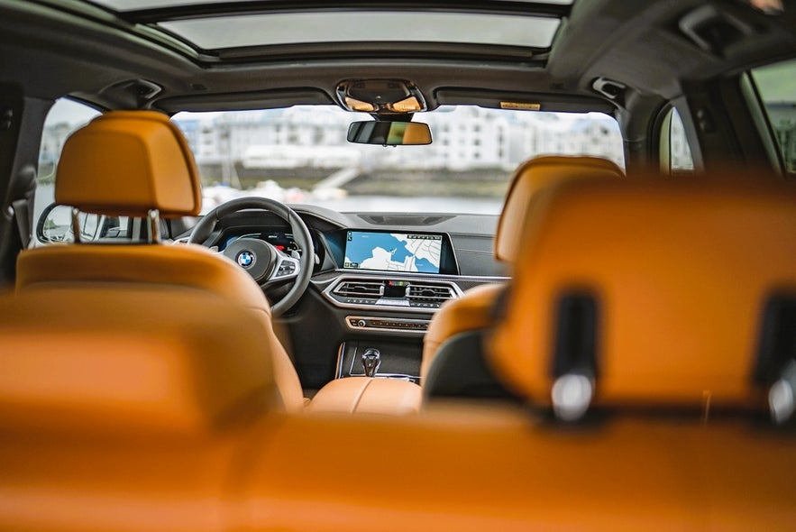 Modern car interior with GPS navigation screen ready for driving in Iceland in August on a self-drive tour.