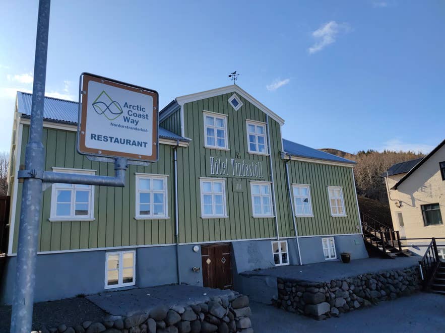 Green wooden building of Jarlstofa in North Iceland.