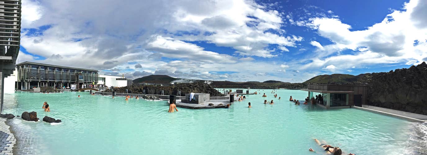 People bathe in the Blue Lagoon geothermal spa in Iceland.
