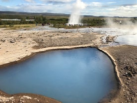 Hot springs and mud pools dot the Geysir geothermal area in Iceland.